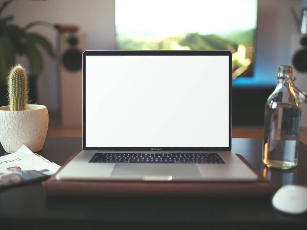 Download MacBook on Table Mockup | The Mockup Club