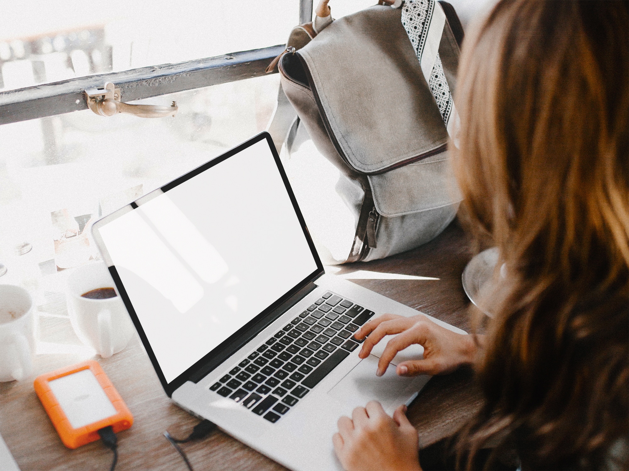 Woman Working on Her MacBook | The Mockup Club